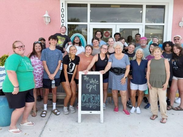Youth group assists White Egret owners