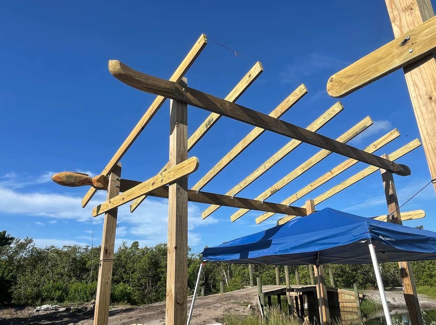 A picnic pavilion under construction features hand-carved finials. - Leslie Lake | Sun
