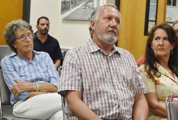 Former building official alleges pressure to condemn properties, threats