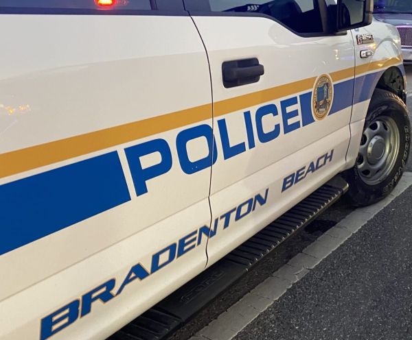 Police confront armed man on pier