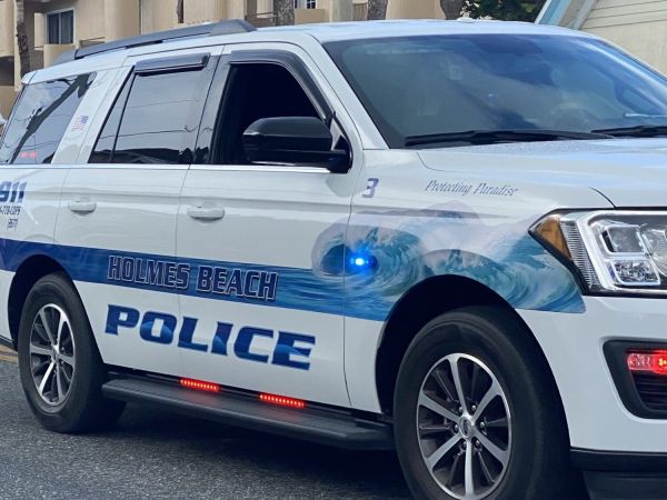 Police find drugs, stolen firearm at beach