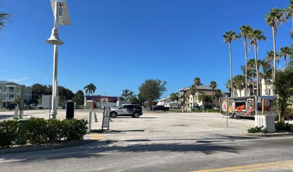 One parking lot meets city deadline; three closed