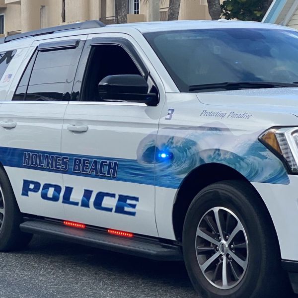 Police find drugs, stolen firearm at beach