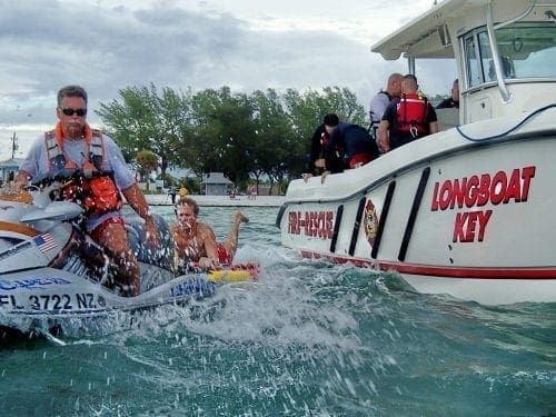 Lifeguard Rex Beach practices rescue techniques at Coquina Beach.