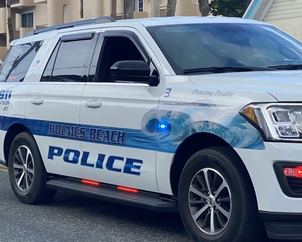 Police find drugs, stolen firearm at beach