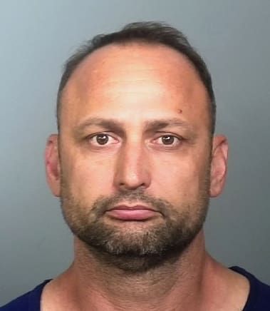 Man arrested after driving Jeep into water