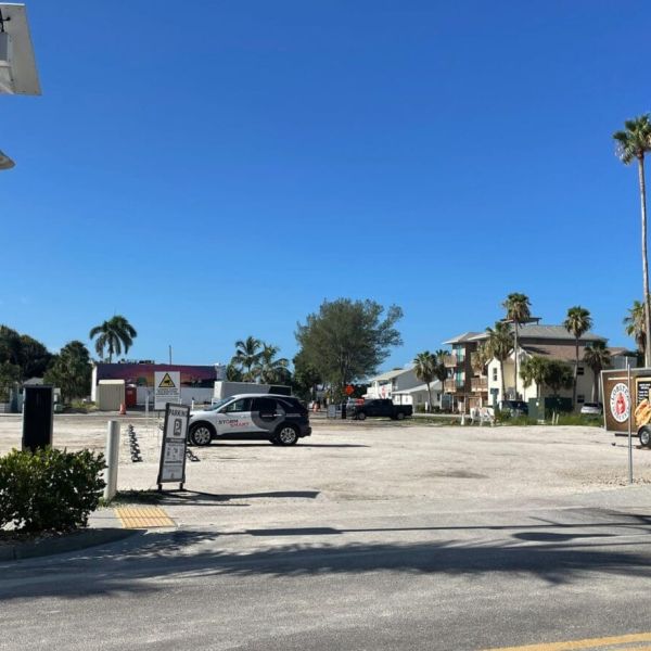 One parking lot meets city deadline; three closed