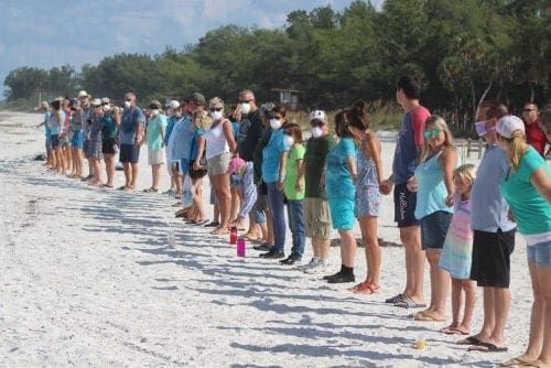 hands along the water