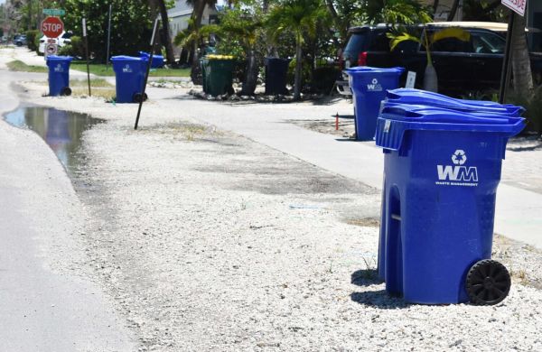 Waste Management proposes mandatory side-door service