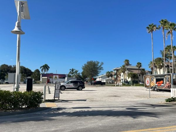 One parking lot meets city deadline; three closed