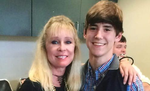 Nurse and others assist unconscious Island Time guest