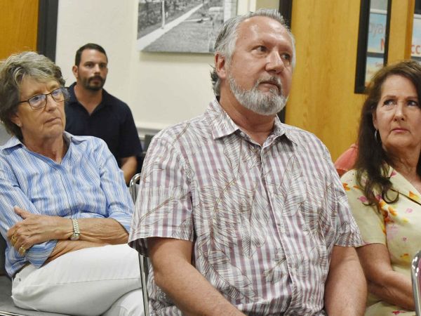 Former building official alleges pressure to condemn properties, threats