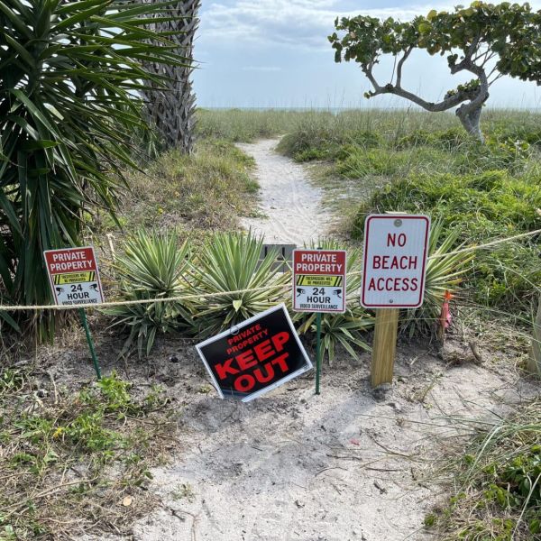 Neighbors clash over beach access path