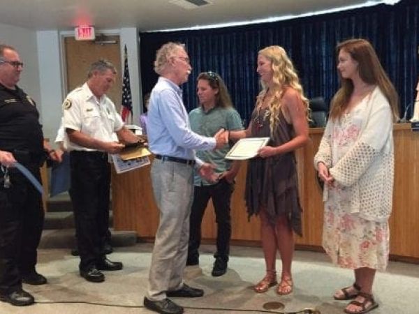 Holmes Beach surf shop fire award Mayor